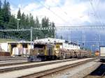 RhB GTERZUG 5315 von Landquart nach Pontresina am 07.09.1994 Einfahrt Pontresina mit Oldtimer-E-Lok Ge 6/6I 411 - Rw 8270 - Rw 8261 - Rw 8206.