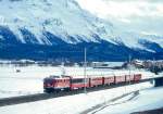 RhB REGIONALZUG 751 von St.Moritz nach Scuol am 08.03.1998 zwischen Samedan und Bever mit E-Lok Ge 4/4I 602 - B 2492 - B 2229 - B 2227 - A 1229 - B 2355- B 2367. Hinweis: ein Planzug mit Kompobildung aus Wagen der letzter Reserve wegen Groverkehr Engadiner Skimarathon. Es sind zwei Stahlwagen Baujahr 1931 eingereiht, ein Gepckwagen stand nicht zur Verfgung. Wunderschn ist die Baumgrenze im Oberengadin erkennbar.   
