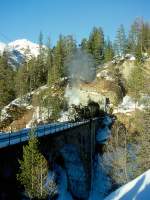 RhB DAMPFZUG 3768 von Scuol nach Samedan am 09.02.1997 auf Val Mela-Viadukt mit Dampf-Lok G 4/5 108 - B 2245 - A 1102 - B 2060 - D 4052I.