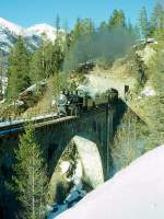 RhB DAMPFZUG 3768 von Scuol nach Samedan am 02.03.1997 auf Val Mela-Viadukt mit Dampf-Lok G 4/5 108 - B 2245 - D 4052I - B 2060 - A 1102.
