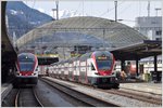 RE4870 mit 511 021 nach Wil und RE5068 mit 511 030 nach Zürich HB warten in Chur auf die Abfahrtszeit.