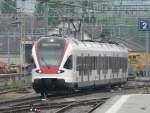 SBB - Regio nach Porrentruy mit dem Triebzug RABe 521 028-1 bei der einfahrt in den Bahnhof Delemont am 11.05.2009