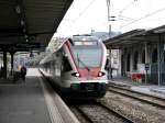 SBB/TILO - Einfahrt des Triebwagen RABe 524 114 im Bahnhof Lugano am 27.02.2015