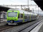 BLS - Triebzug 525 024-6 bei der Ausfahrt aus dem Bahnhof Thun am 21.03.2010