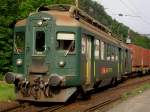 Der Bde 4/4 1632 der OeBB am 29.08.2008 bei der Ausfahrt aus Klus mit einem Mllzug.