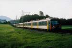 SBB: S-Bahn mit RABDe 12/12 (11101-11118, 1965/67) in Dreifachtraktion an einem frühen Morgen des Sommers 2004 bei Hinwil.