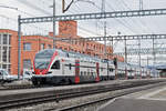 RABe 511 123 durchfährt den Bahnhof Muttenz. Die Aufnahme stammt vom 09.03.2018.