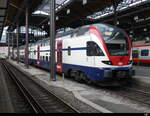 SBB - Zürcher S-Bahn RABe 511 048-6 als IR von Basel nach Sursee im Bahnhof Basel SBB am 19.03.2023