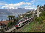 RABe 524 001 hat am 10. April 2013 gerade den kleinen Bahnhof von San Nazzaro am Lago Maggiore verlassen und fährt nun an der Kirche vorbei in Richtung Luino - Malpensa Aeroporto. Die Züge der TILO S30 verkehren im Zweistundentakt. 