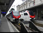 SBB - Triebzüge RABe 524 308 und RABe 524 302 im Bahnhof von Locarno am 12.02.2021