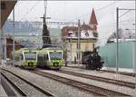 Alt und Neu in Huttwil. Zwischen zwei NINAs der BLS und dem modernen BLS-Gebäude sind Dampflok Ed 3/4 Nr. 2 der Solothurn-Münster-Bahn und die alte Villa ein Fenster in vergangene Tage. Huttwil, Februar 2018.