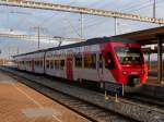 bls - NINA Triebzug RABe 525 036-0 mit im Bahnhof Ins am 26.02.2012