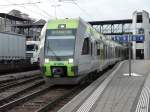 bls - Triebzug Ltschberger RABe 535 115 + RABe 535 112 bei der ausfahrt aus dem Bahnhof von Spiez als RE nach Brig am 25.02.2011    