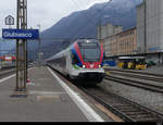 SBB - Triebzüge  RABe 524 104 und RABe 524 012 bei der einfahrt im Bahnhof von Giubiasco am 12.02.2021