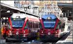 IR1133 mit ABe 8/12 3502 nach St.Moritz und S2 1553 mit ABe 4/16 3105 nsch Thusis in Chur.
