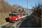 De 110 022-1 mit dem IR 2222 von Luzern nach Interlaken Ost kurz nach Niederried am 5. Feb. 2011.