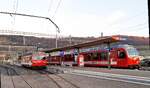 CJ Bf Glovelier__Alt-Tw 616 Be 4/4 neben aktuellem Tw-Zug nach La Chaux-de-Fonds [Tw 651; Be 4/4 Stadler].__27-02-2026