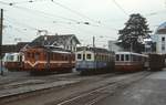 Hochbetrieb auf dem Bahnhofsvorplatz von Aigle: An einem Maiabend 1980 stehen dort (von links nach rechts) der ABDeh 2/4 202 der AL (Aigle-Leysin), daneben die ABDe 4/4  3 und 12 der ASD