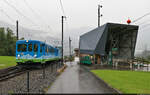 Bei einsetzendem Regen fährt Steuerwagen 23 mit BDhe 2/4 13 die Rigi hinauf, hier an der Station Kräbel, wo in eine Seilbahn zur Scheidegg eingestiegen werden kann.