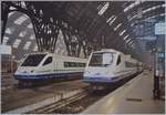 In der etwas nebligen Bahnhof Halle von Milano Centrale stehen zwei CIS ETR 470; der eine kam von Basel, während der andere in Kürze sich auf die Fahrt nach Stuttgart macht.

Ein Analog-Bild vom Februar 1999
