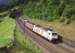 A pair of Crossrail TRAXX locomotives (E185 580 leading) haul a long intermodal train north past Wassen, 16 August 2014