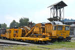 Verschiedene Bahnbaumaschinen und -wagen wareb Ende August 2019 in Ljubljana zu sehen.