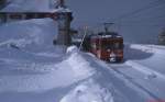 Nur am Bahnhofsschild ist erkennbar, dass diese Aufnahme nicht in den tiefverschneiten Alpen, sondern im Februar 1996 in Cotos, dem Endbahnhof der Madrider Vorortelinie 9, entstanden ist.