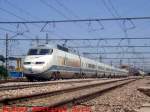 The Euromed number 1091 from Barcelona Sants to Alacant Terminal passes fast Silla station wich is near Valncia in the east of Spain. This train is the 101-005 nicknamed Euromed, is the same of the 100  triebzge  but with 3 kv DC (GleichStrom) and 1668 mm track gauge. Max speed 220 km/h, equipped with ASFA (similar to SIFA) and ATP.