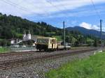 Eine kleine Draisine fahrt mit zwei kleine Gterwagons in die richtung Wrgl bei Brixen im Thale am 16-8-2010. In welche Kategorie gehrt dieses Bild?