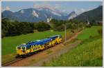 Plasser & Theurer Dynamic Stopfexpress 09-4X der Firma bbw (Bahnbau Wels Gmbh), eine Weiterentwicklung des bewhrten Stopfexpress 09-3X, am 20.8.2009 auf dem Weg nach Admont mit dem Stift Admont im Hintergrund.