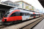 ÖBB 4024 001-2 mit  AMS Sticker  wartet auf die Abfahrt nach Lindau Hbf.