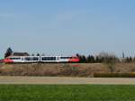 5022-Garnitur als R5973, entlang des frisch gerodeten Bahndammes, im Hintergrund wird nun der Kirchturm von Ried ersichtlich; 140330