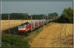 Die ehemalige CAT Lok 1014 005 (City Airport Train) schiebt am 23.7.2006 ihren E 7629 von Wien nach Bratislava.