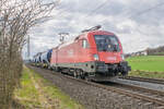 1016 040 ist am 22.03.2023 bei Kerzell mit einem Kalizug in Richtung Norden unterwegs