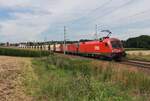 Mit einem beladenen Erzzug von Koper Luka nach Linz Stahlwerke warten am 30.7.2025 die 1016 037  Samuel  und die 1293 030 in Kematen-Piberbach auf die Weiterfahrt.