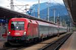 BB EuroCity 668  CARITAS Kinderpatenschaften  wartet leicht versptet auf seinen Abfahrtsauftrag in Wrgl Hbf.