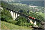 1216 025 World Record und eine 1016, ziehen den Schlammkreide Ganzzug G 48714 ber die Falkensteinbrcke nahe Obervellach. 
16.07.2010