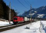 1016 009 mit einer Rola zum Brennersee am 21.02.2012 bei Terfens.
