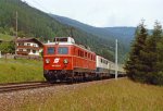 1110.530+DB 111 mit D-489 zwischen Matrei und Stainach am Brenner. Juni 1986