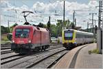 ÖBB 1116 184 für IC186 nach Stuttgart und IRE3070 mit 612 521 nach Basel Bad Bf in Singen (Htwl).