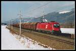 1116 074 mit Güterzug bei Niklasdorf am 5.03.2004.