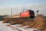 1116 242-7 mit Korridorzug OIC 869 nach Wien bei Bernau am 08.02.2011