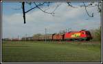 1116 064 der GySEV (ROeEE) mit einem Gterzug kurz vor der Durchfahrt in Pottendorf-Landegg am 15.4.2006.