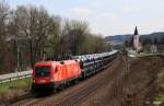 BB 1116 174-2 mit Ganzzug Autotransport Richtung Vilshofen, KBS 880 Passau - Nrnberg, fotografiert bei Hausbach an der Donau am 04.04.2012 --> Hinten rechts im Vilshofener Ortsteil Hausbach die