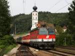 Auch die 1144 288 besitzt noch keine Wortmarke, als sie mit REX 1795 am 26.08.2009 in Wernstein am Inn abgelichtet wurde.