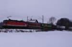 Die 1144 260 -7 fr mit einem Trailer-Zug (LKW - Anhnger) am 16.01.2010 durch Kfering.