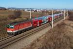 1144 077 ist mit R 2323 nach Wr. Neustadt Hbf. unterwegs. Die Aufnahme entstand am 15.12.2013 bei Guntramsdorf.