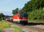 Die 1144 204 mit einem Containerzug am 05.06.2011 bei der Durchfahrt in Aßling.