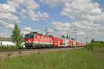 Bei herrlicher Wolkenstimmung fährt 1144.214 mit R-2317 bei Sollenau am 4.5.14 richtung Wr.Neustadt.