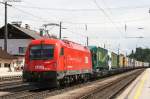 Nachschuss 1044 101-2 und 1216 021-4 (zugschluss)mit einer RoLa in Richtung Wrgl bei der Durchfahrt Brixlegg am 23.5.08